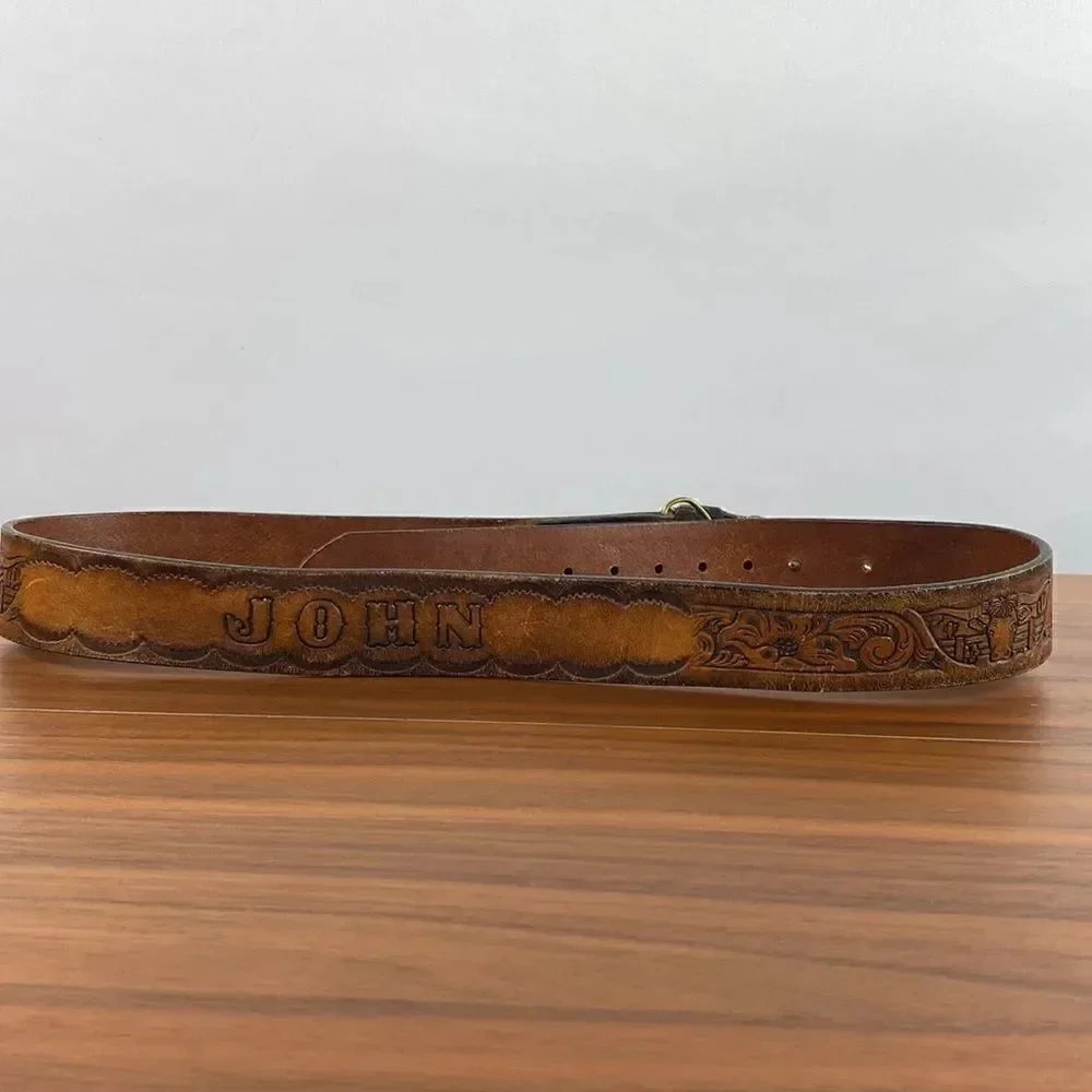 Vintage brown leather hand tooled Western belt.